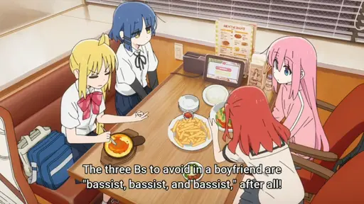 Nijika explaining to Bocchi that "The three Bs to avoid in a boyfriend are 'bassist, bassist and bassist' after all" whilst Ryō looks sad.