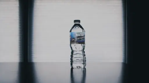 A water bottle labelled with "De-Estrogenized Water, 0.5% Estrogen by Volume"
