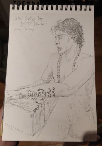 A young shirtless man playing a harmonicum and chanting mantras, he wears long malas around his neck and has a tattoo with the Tibetan mantra "Om mani padme hum"